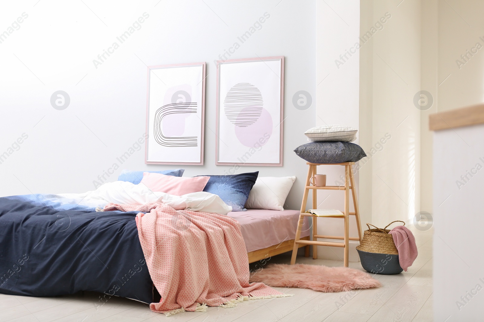 Photo of Comfortable bed with stylish linens in room