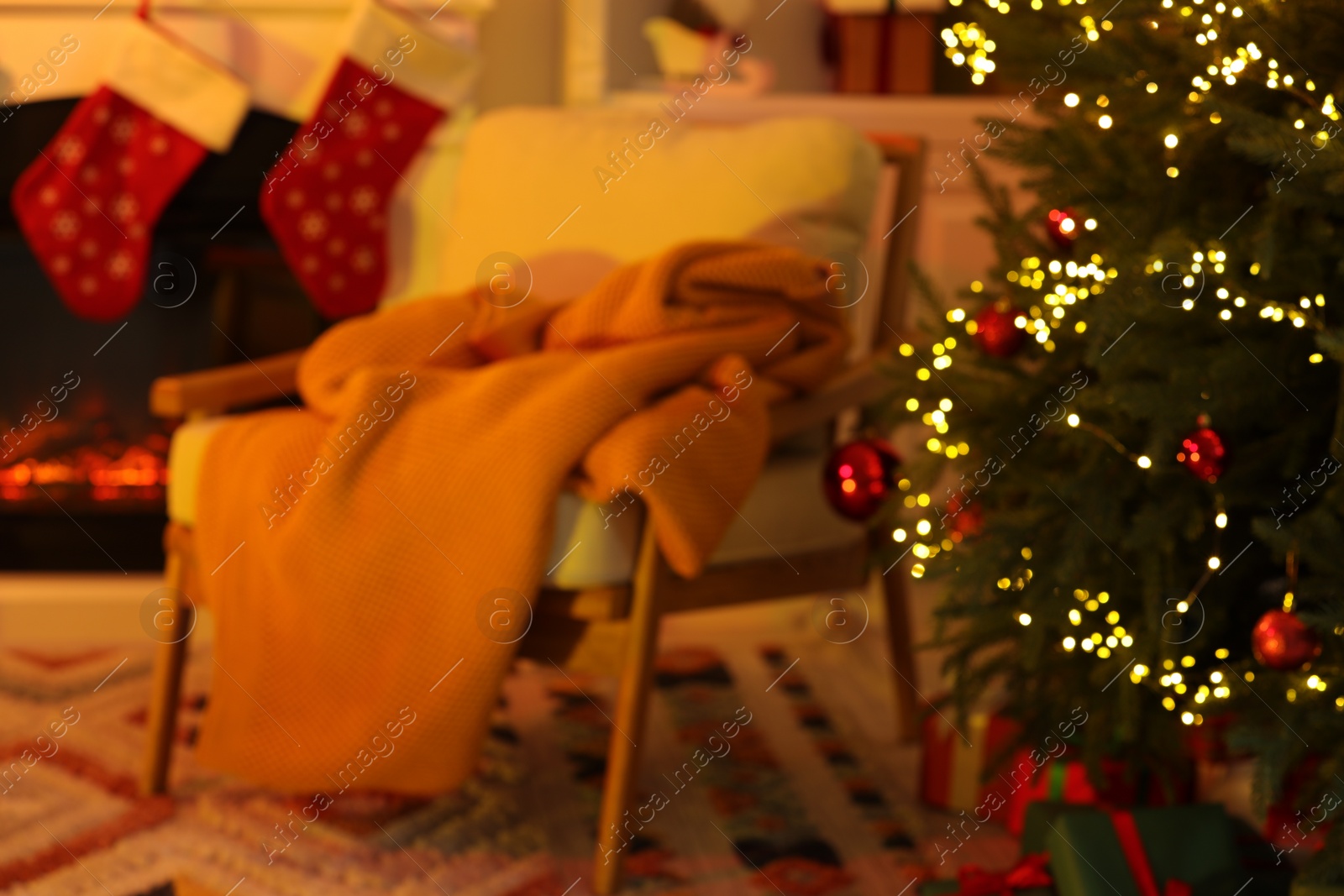 Photo of Blurred view of cozy room with Christmas decor. Interior design