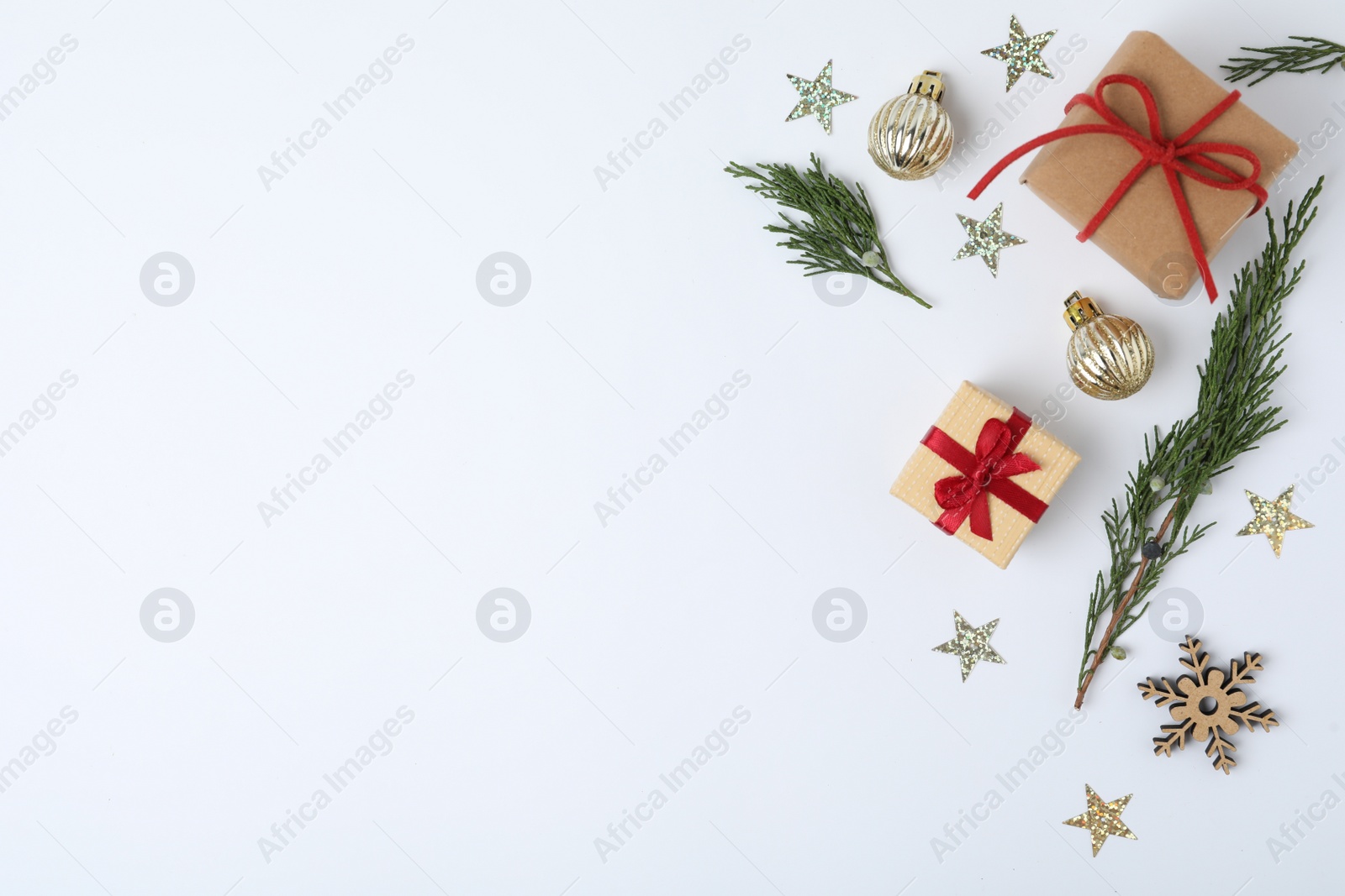 Photo of Winter composition with fir tree and gift boxes on white background, top view