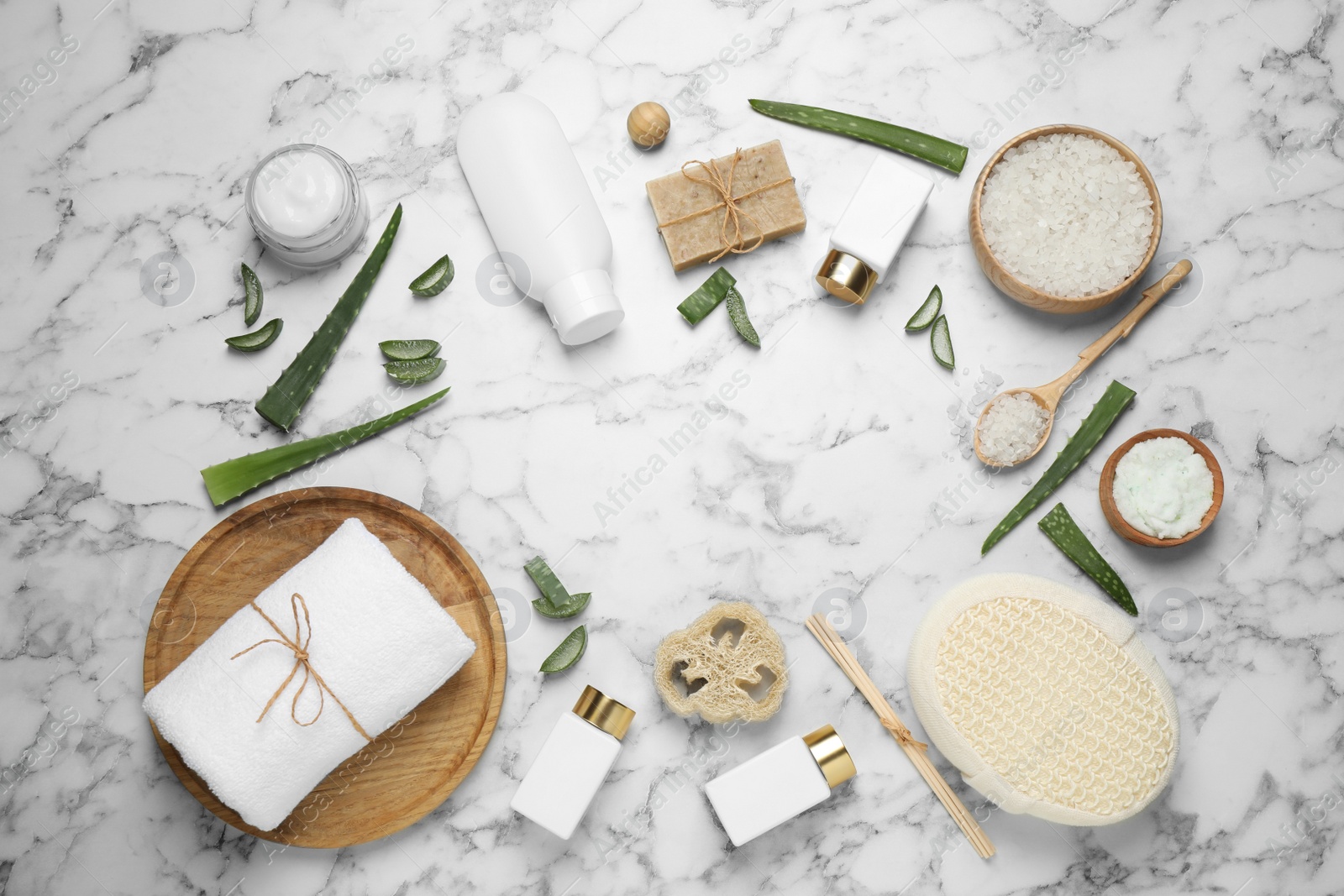 Photo of Flat lay composition with aloe vera and cosmetic products on white marble background. Space for text