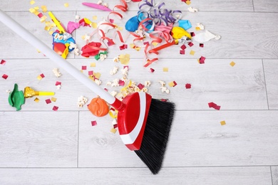 Sweeping trash after party with bristle broom indoors