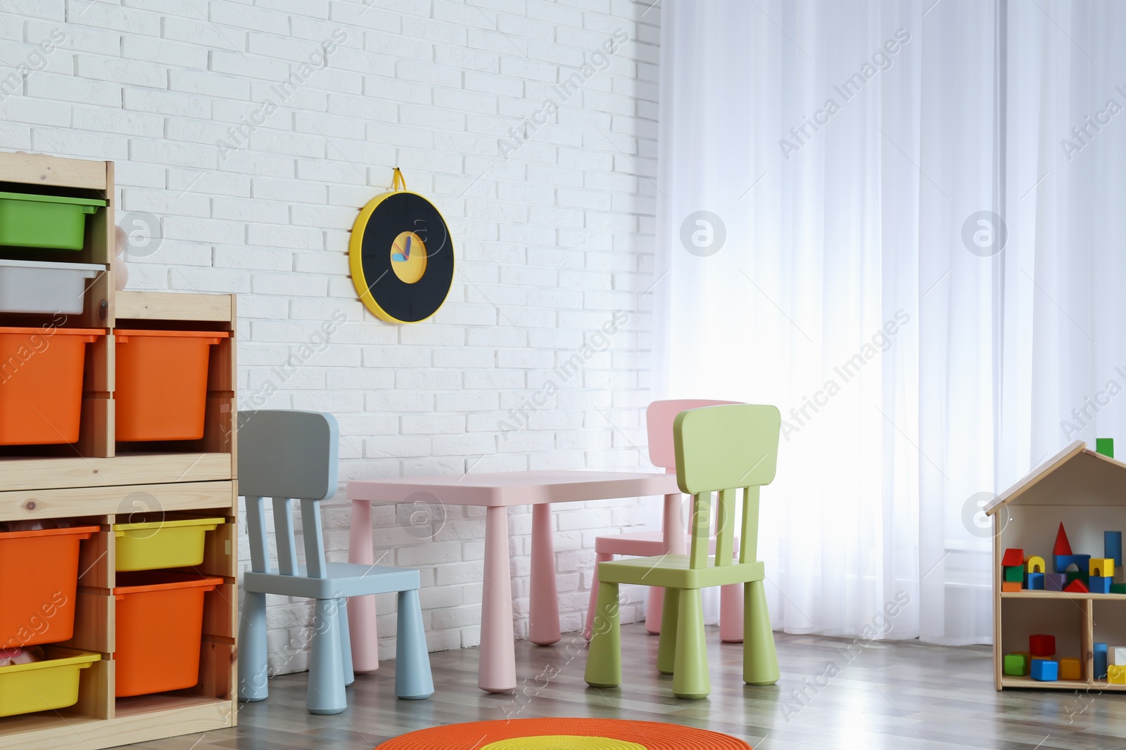 Photo of Modern child room interior with table and chairs