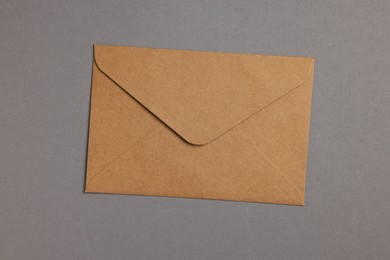 Photo of Envelope made of parchment paper on grey background, top view