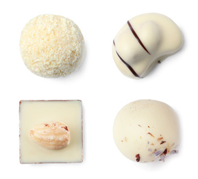 Set with different chocolate candies on white background, top view