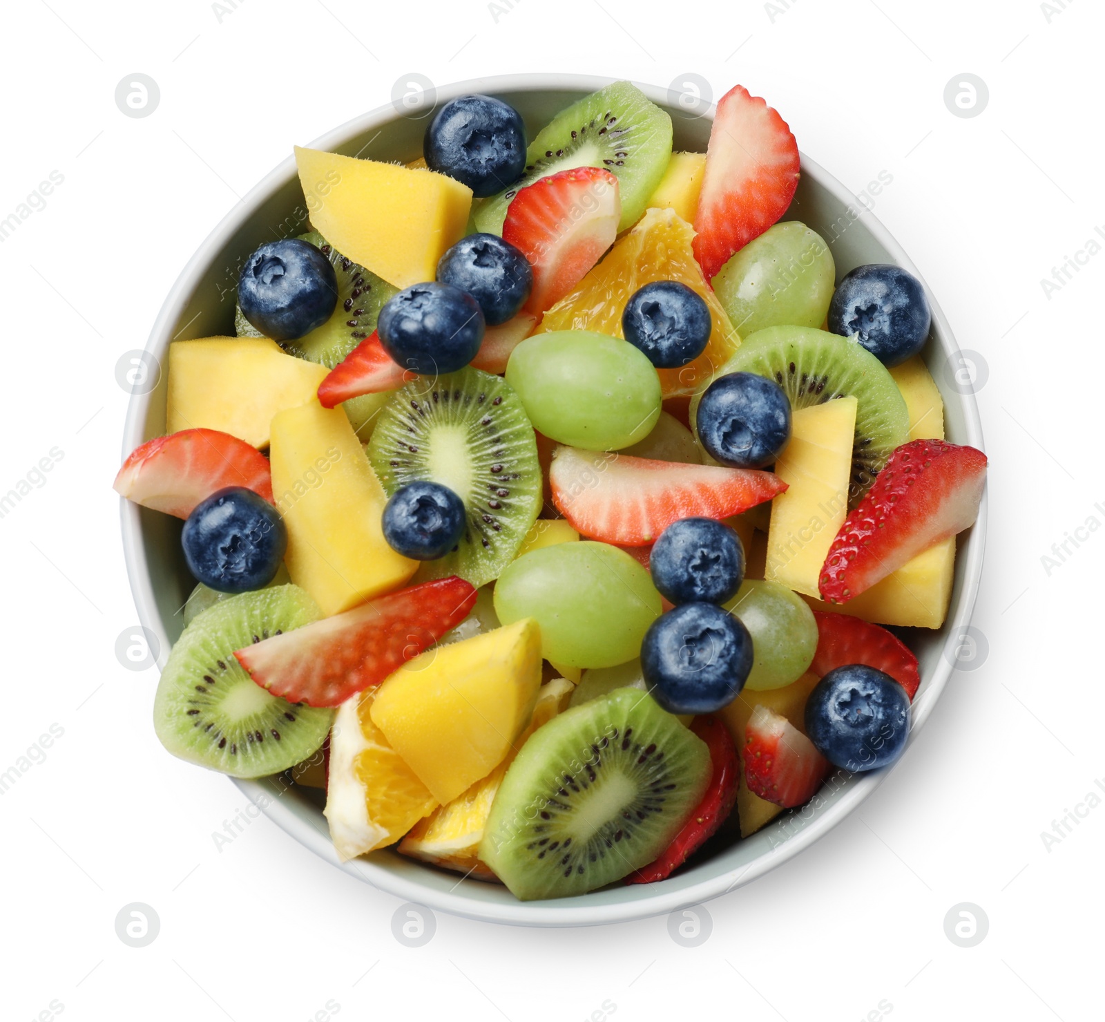 Photo of Tasty fruit salad in bowl isolated on white, top view