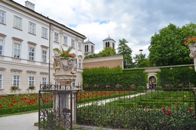 Photo of SALZBURG, AUSTRIA - JUNE 22, 2018: Beautiful Mirabell garden with blooming flowers