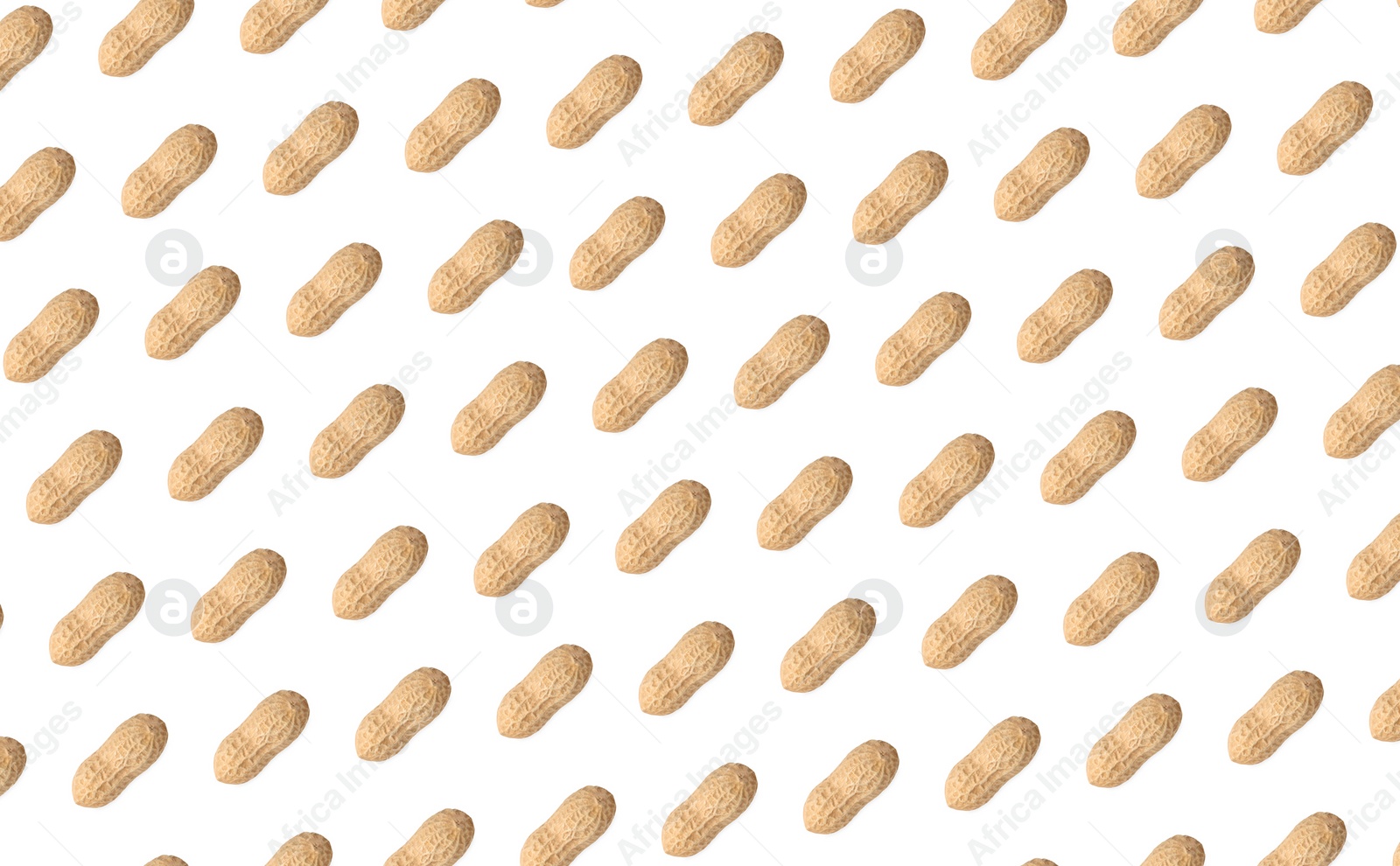 Image of Pattern of unpeeled peanuts on white background