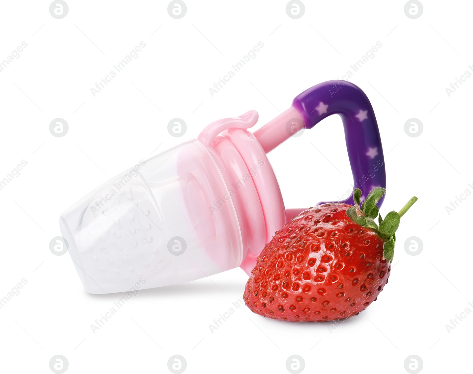 Photo of Empty nibbler and strawberry on white background. Baby feeder