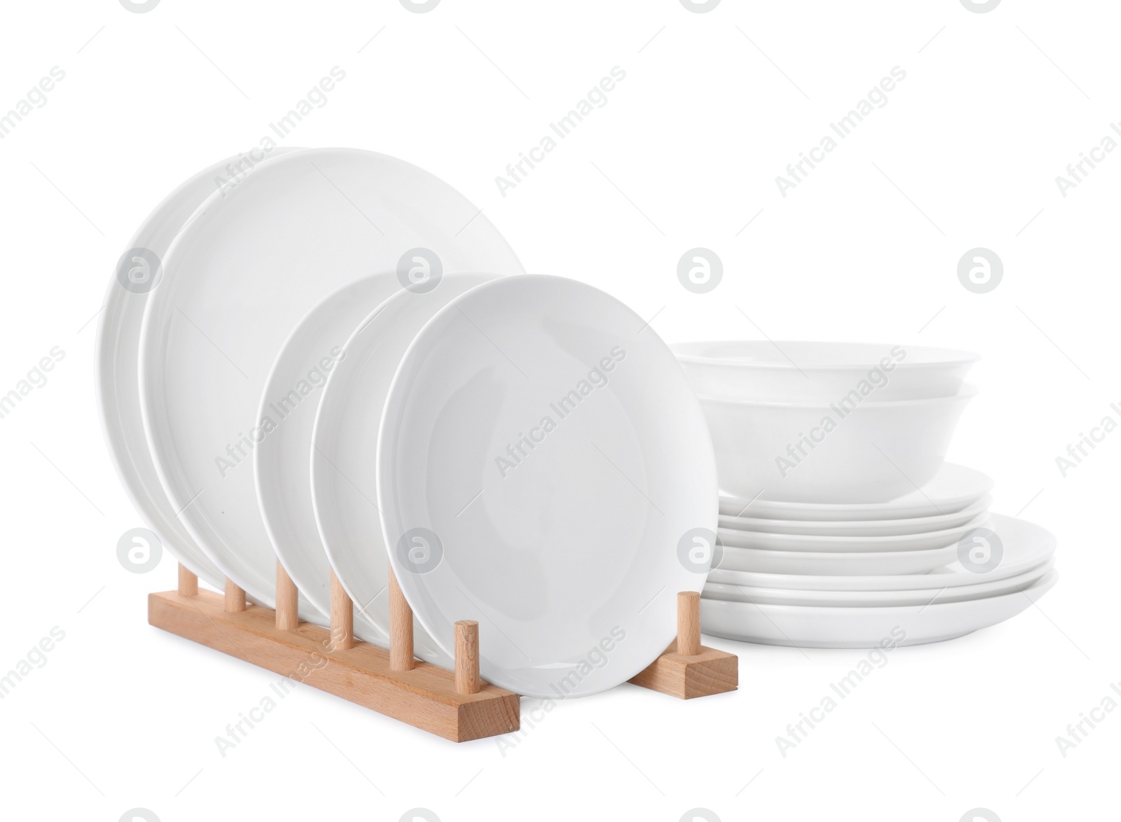 Photo of Set of clean tableware isolated on white