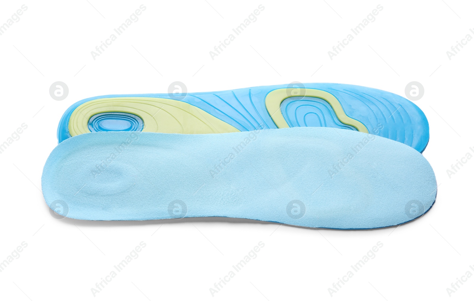 Photo of Light blue orthopedic insoles isolated on white