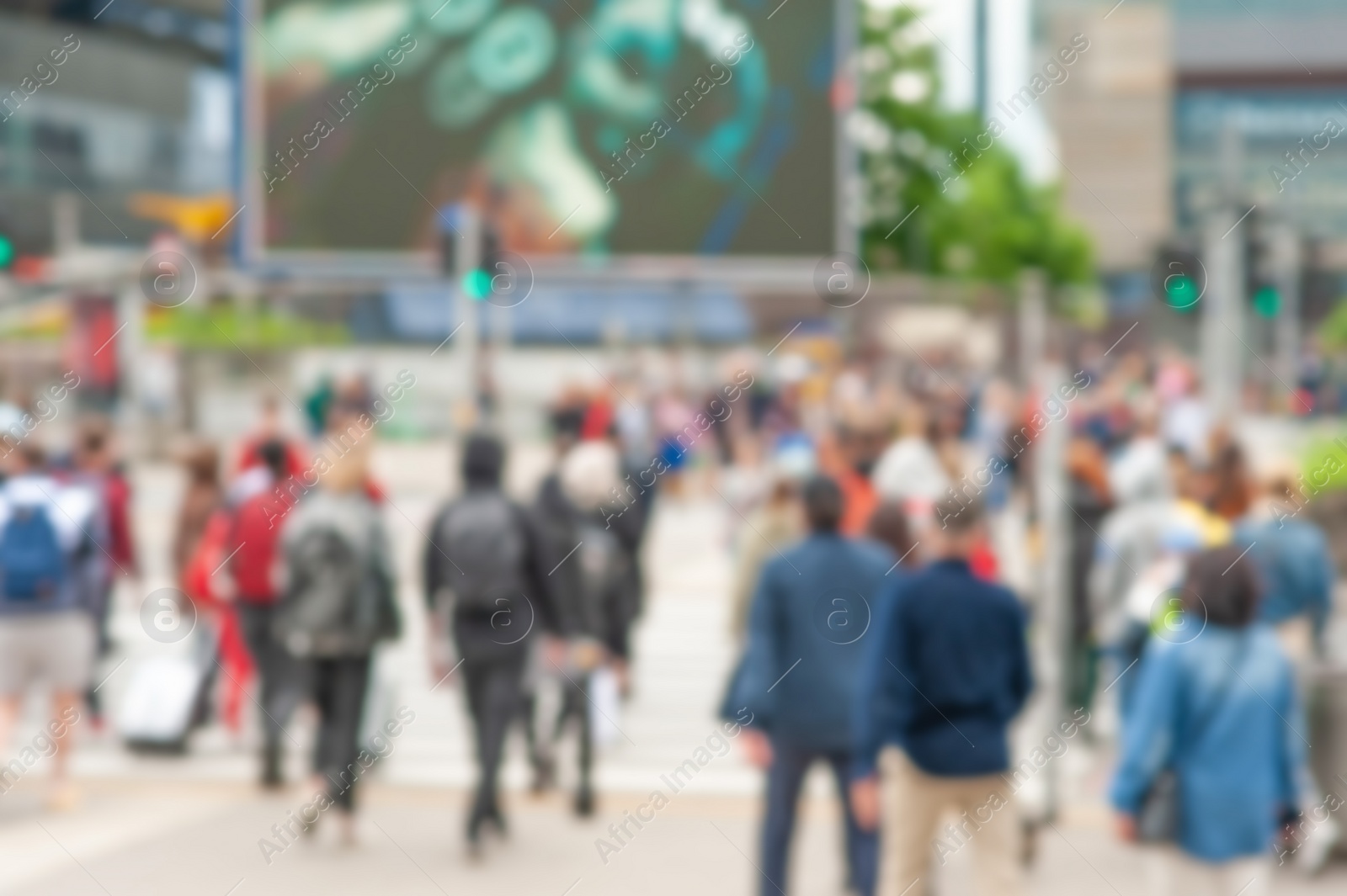 Photo of People crossing street in city, blurred view