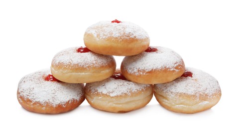 Delicious donuts with jelly and powdered sugar on white background