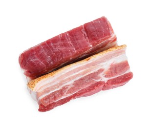 Photo of Pieces of raw pork belly isolated on white, top view