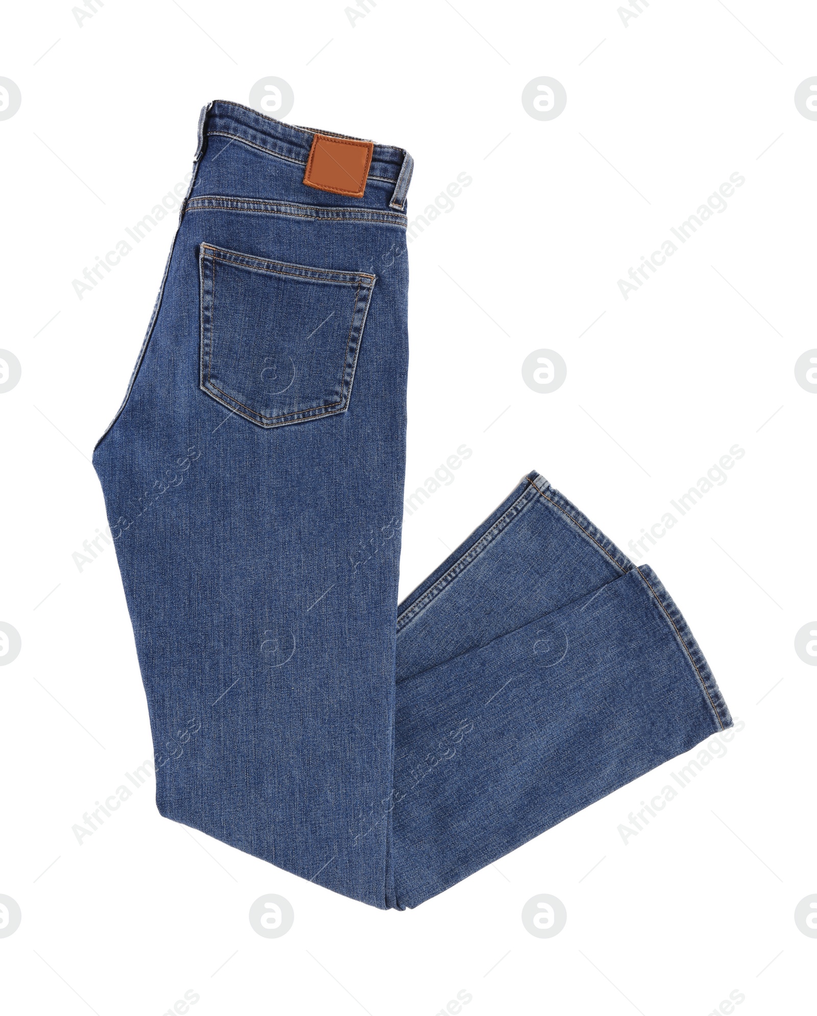 Photo of Dark blue jeans isolated on white, top view. Stylish clothes