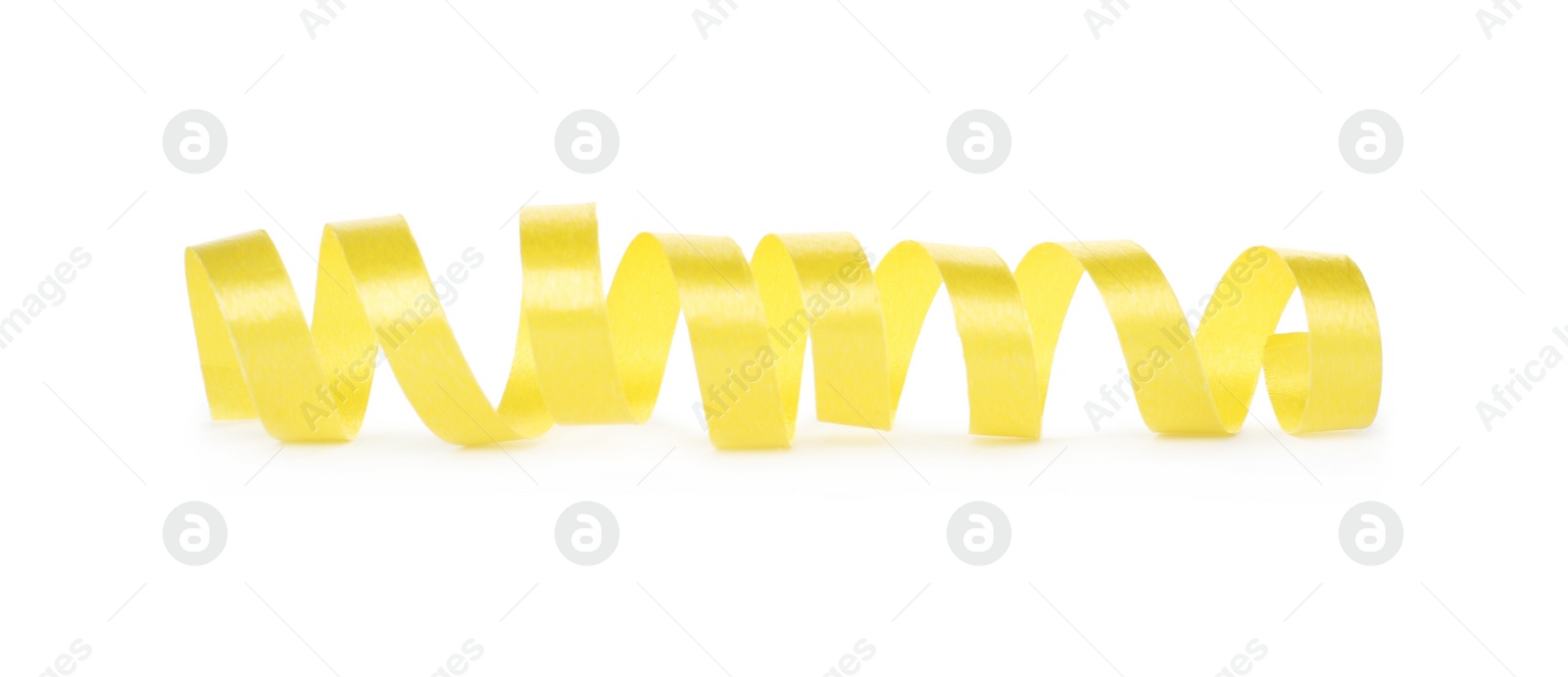 Photo of Shiny yellow serpentine streamer on white background