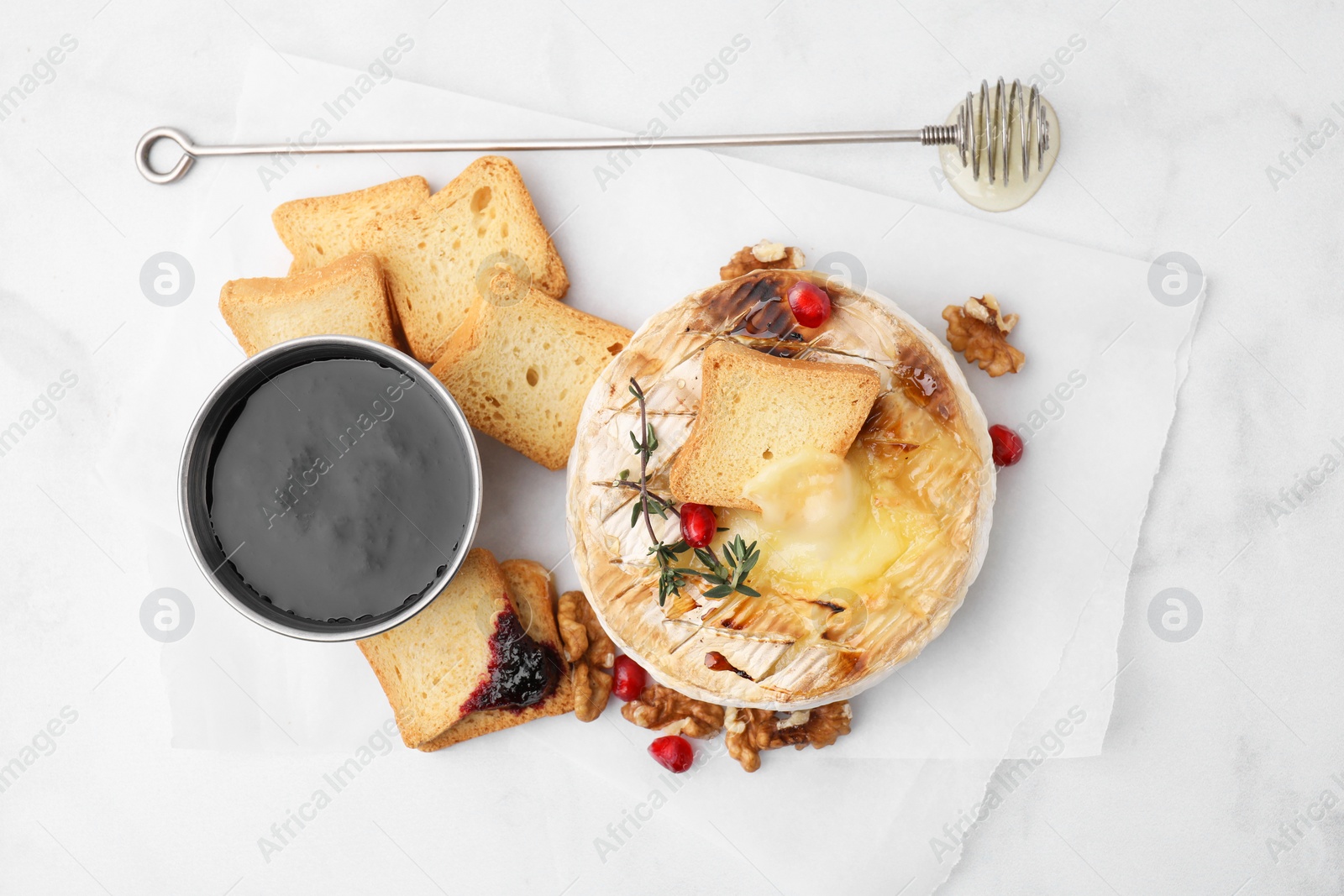 Photo of Flat lay composition with tasty baked camembert on white marble table