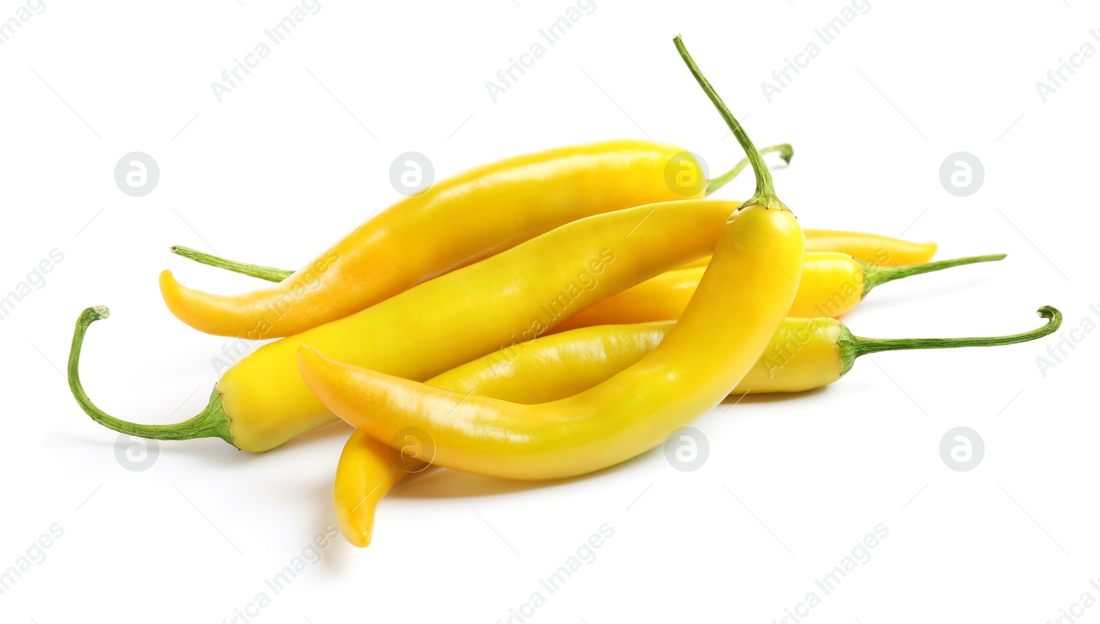 Photo of Ripe yellow hot chili peppers isolated on white