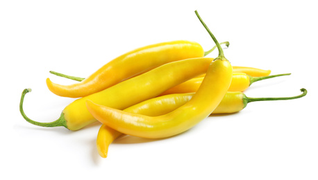 Photo of Ripe yellow hot chili peppers isolated on white