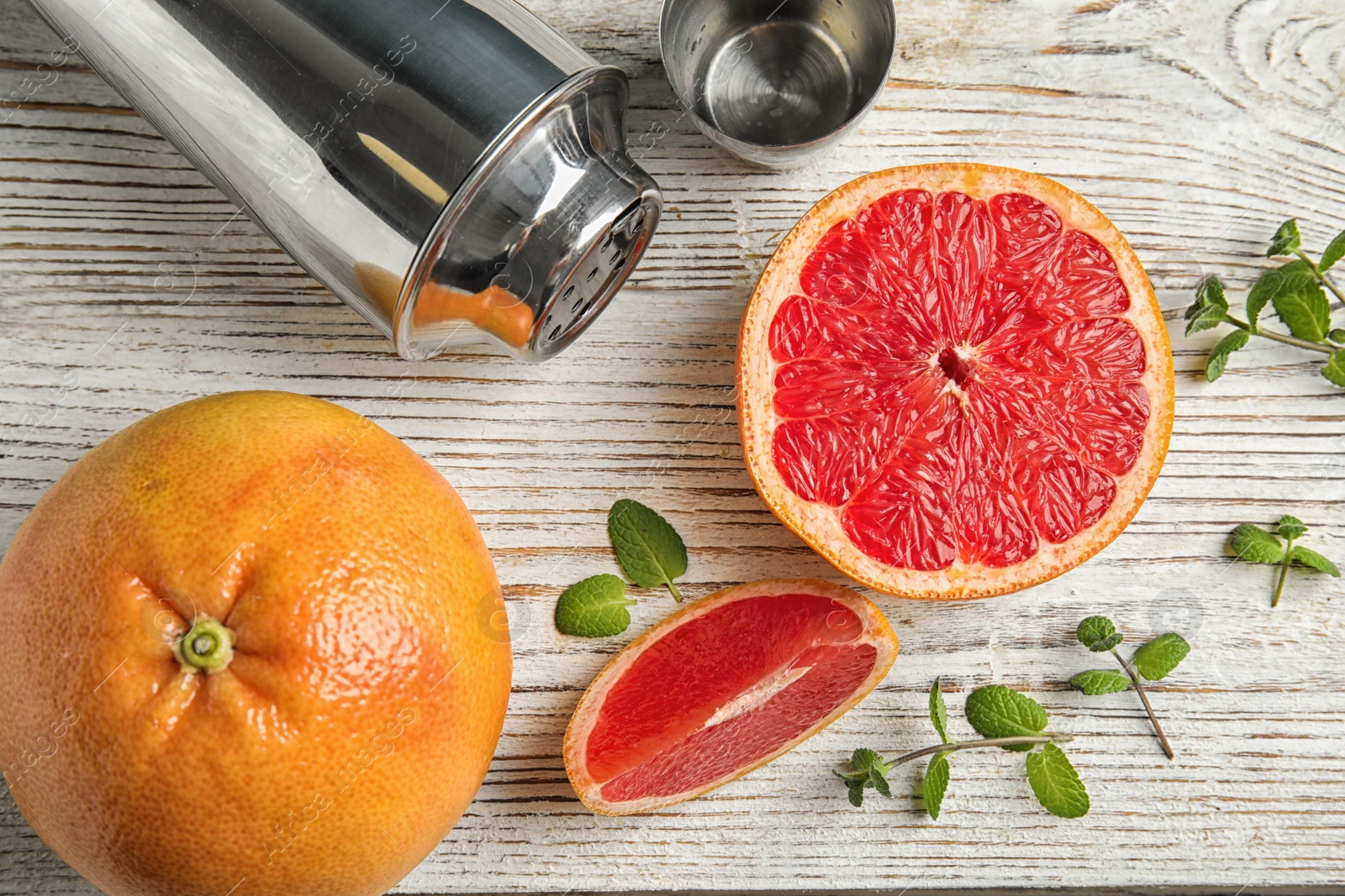 Photo of Flat lay composition with grapefruits on wooden background