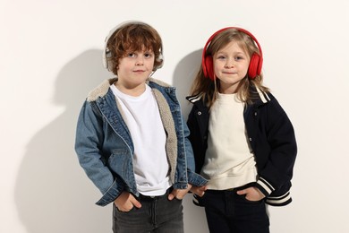 Fashion concept. Stylish children posing on white background