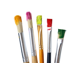 Photo of Different brushes with paints on white background