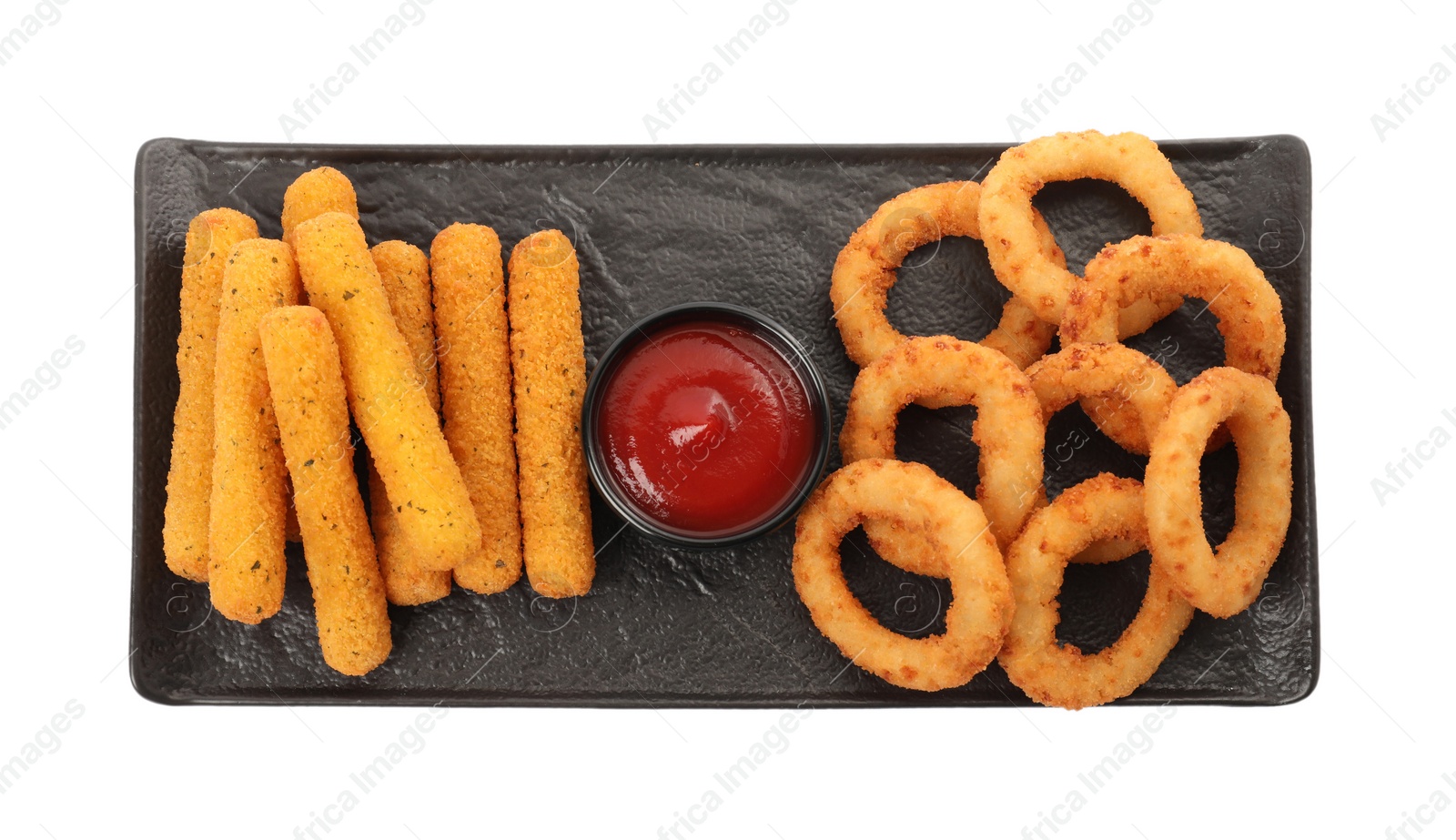 Photo of Tasty fried onion rings, cheese sticks and ketchup isolated on white, top view