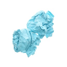 Photo of Crumpled sheets of light blue paper on white background, top view