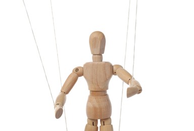 Photo of One wooden puppet with strings on white background