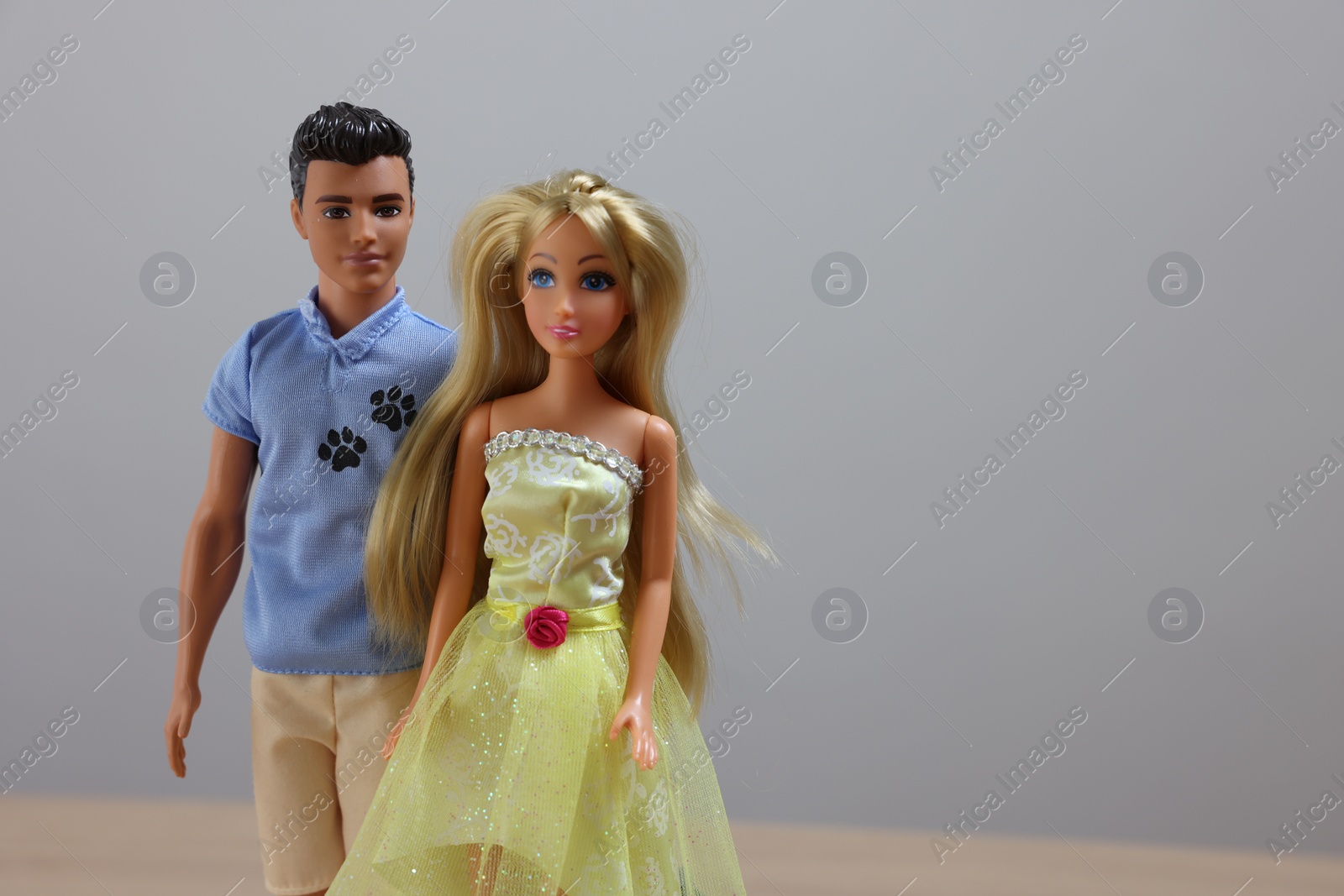 Photo of Leiden, Netherlands - September 20, 2023: Stylish Barbie and Ken dolls on light gray background, space for text