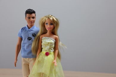 Leiden, Netherlands - September 20, 2023: Stylish Barbie and Ken dolls on light gray background, space for text