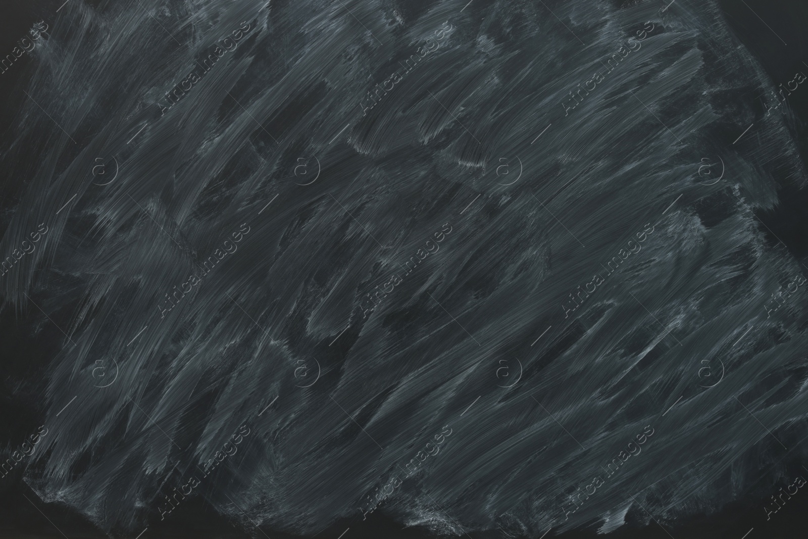Photo of Dirty black chalkboard as background. School equipment