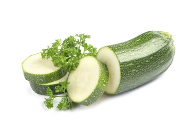 Photo of Cut green ripe zucchini and parsley isolated on white