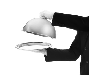 Photo of Waiter holding metal tray with lid on white background