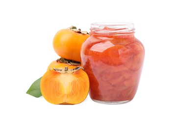 Photo of Jar of tasty persimmon jam and fresh fruits on white background