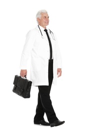 Full length portrait of male doctor with briefcase isolated on white. Medical staff