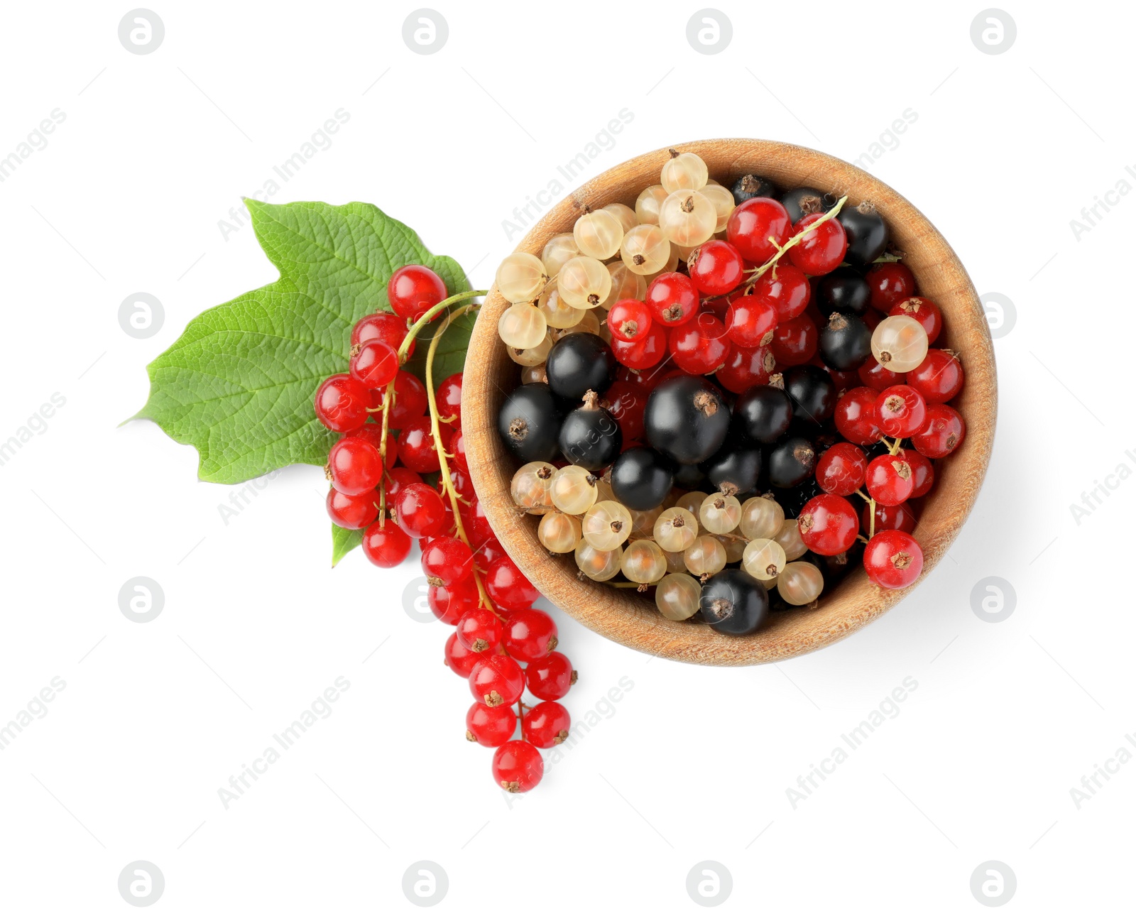 Photo of Fresh red, white and black currants in bowl with green leaf isolated on white, top view