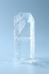 Blocks of clear ice on light blue background