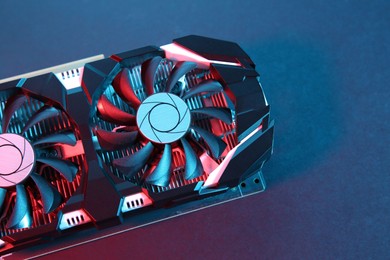 Photo of Computer graphics card on color background, top view. Space for text