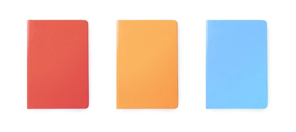 Image of Set with multicolor notebooks on white background, top view. Banner design
