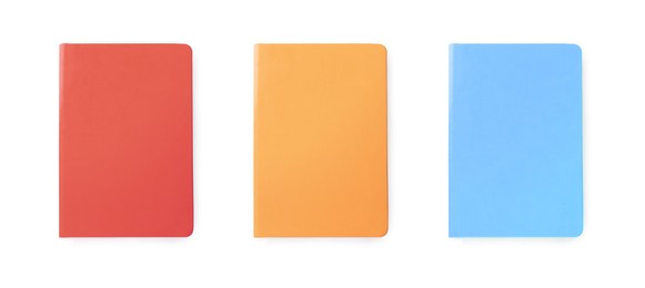 Set with multicolor notebooks on white background, top view. Banner design