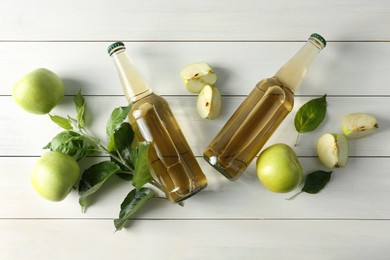 Flat lay composition with delicious apple cider on white wooden table