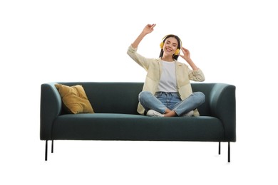 Photo of Young woman listening to music on comfortable green sofa against white background