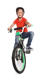 Photo of Portrait of cute little boy with bicycle on white background