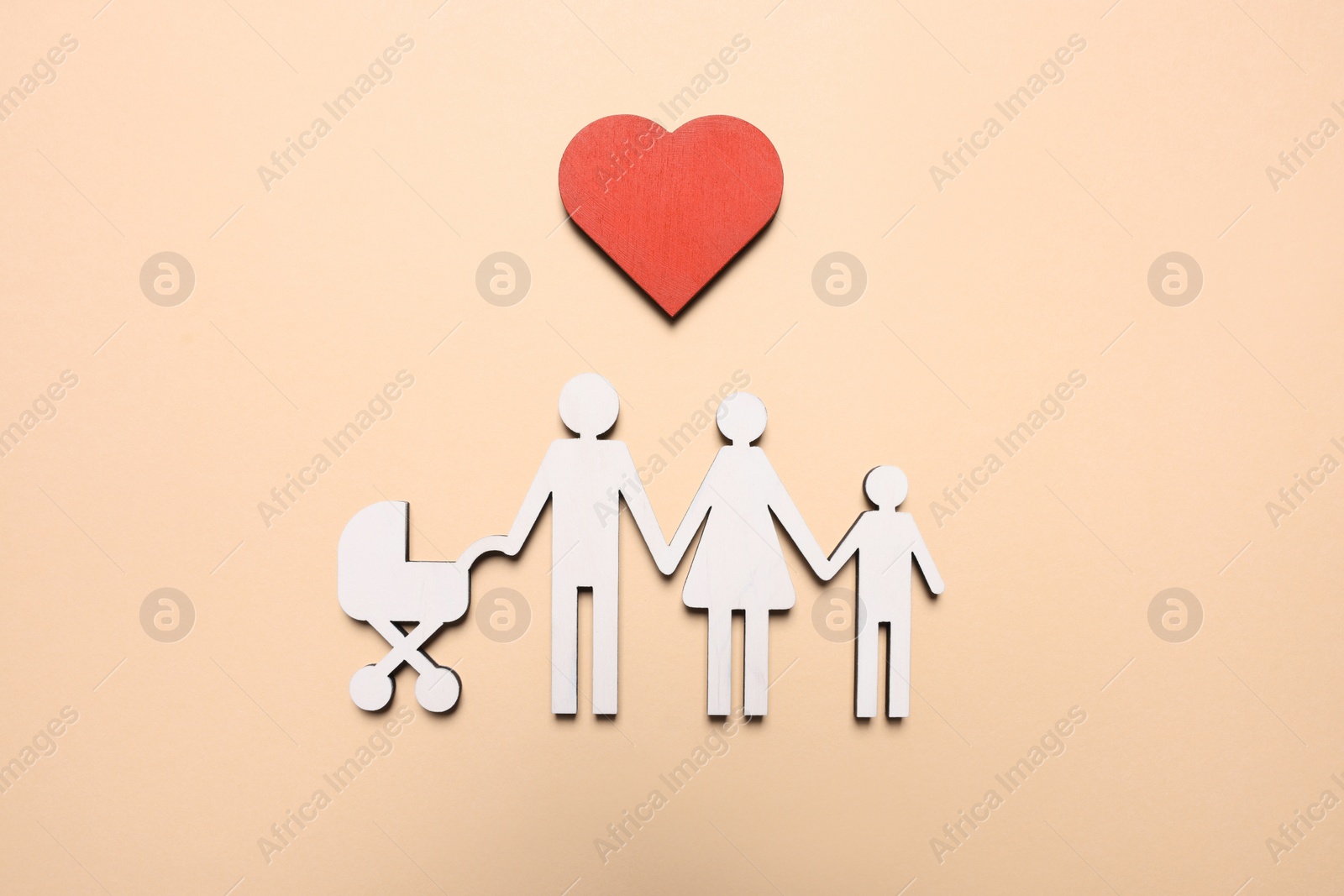 Photo of Figures of family and heart on beige background, top view. Insurance concept