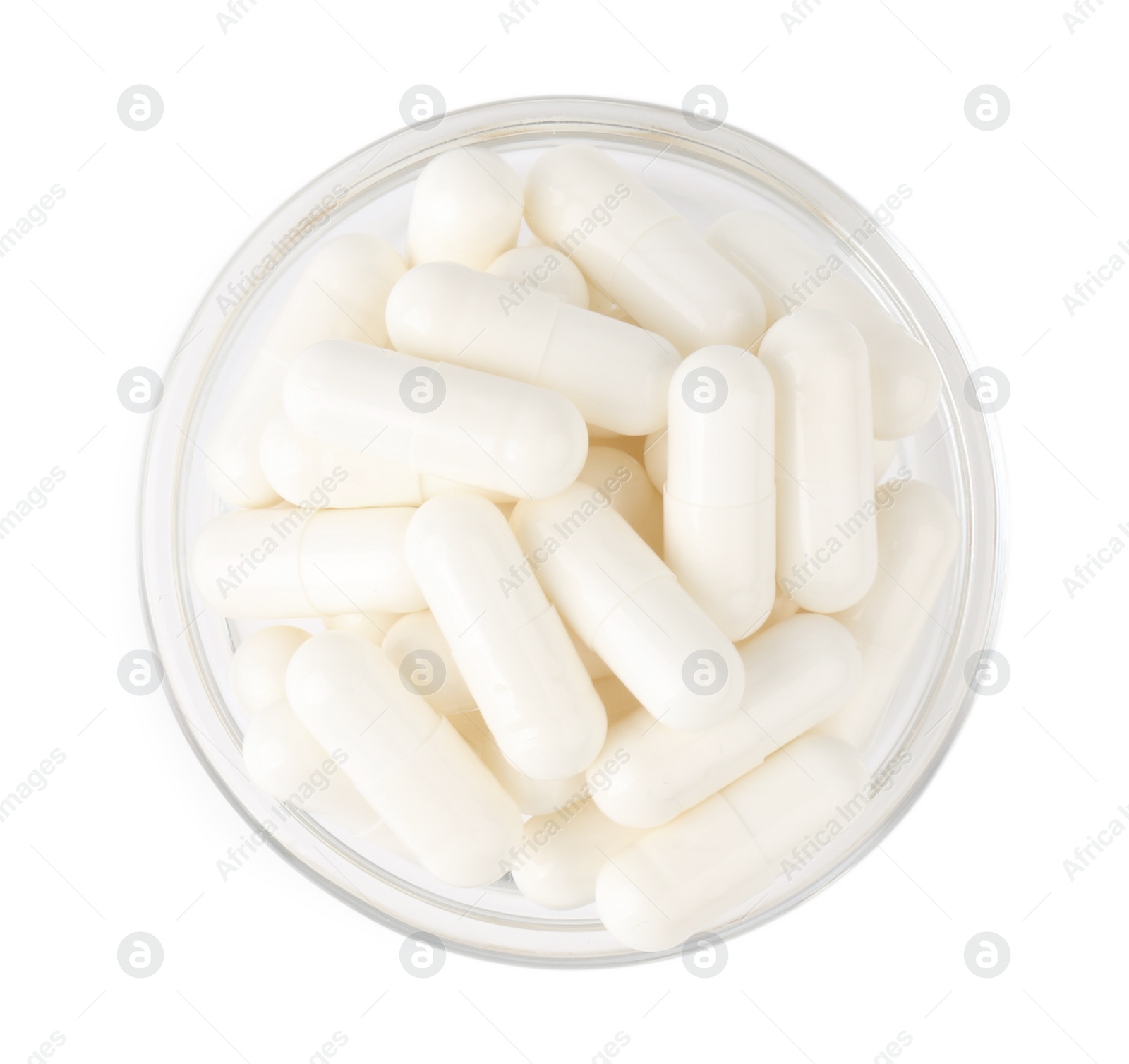 Photo of Vitamin capsules in glass bowl isolated on white, top view