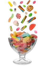 Image of Different delicious candies falling into glass dessert bowl on white background 