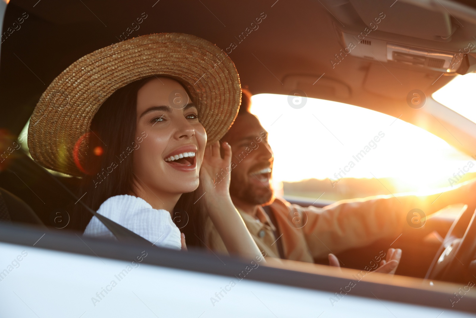 Photo of Happy couple enjoying trip together by car, selective focus