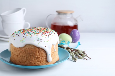 Photo of Easter cake served on white table, space for text
