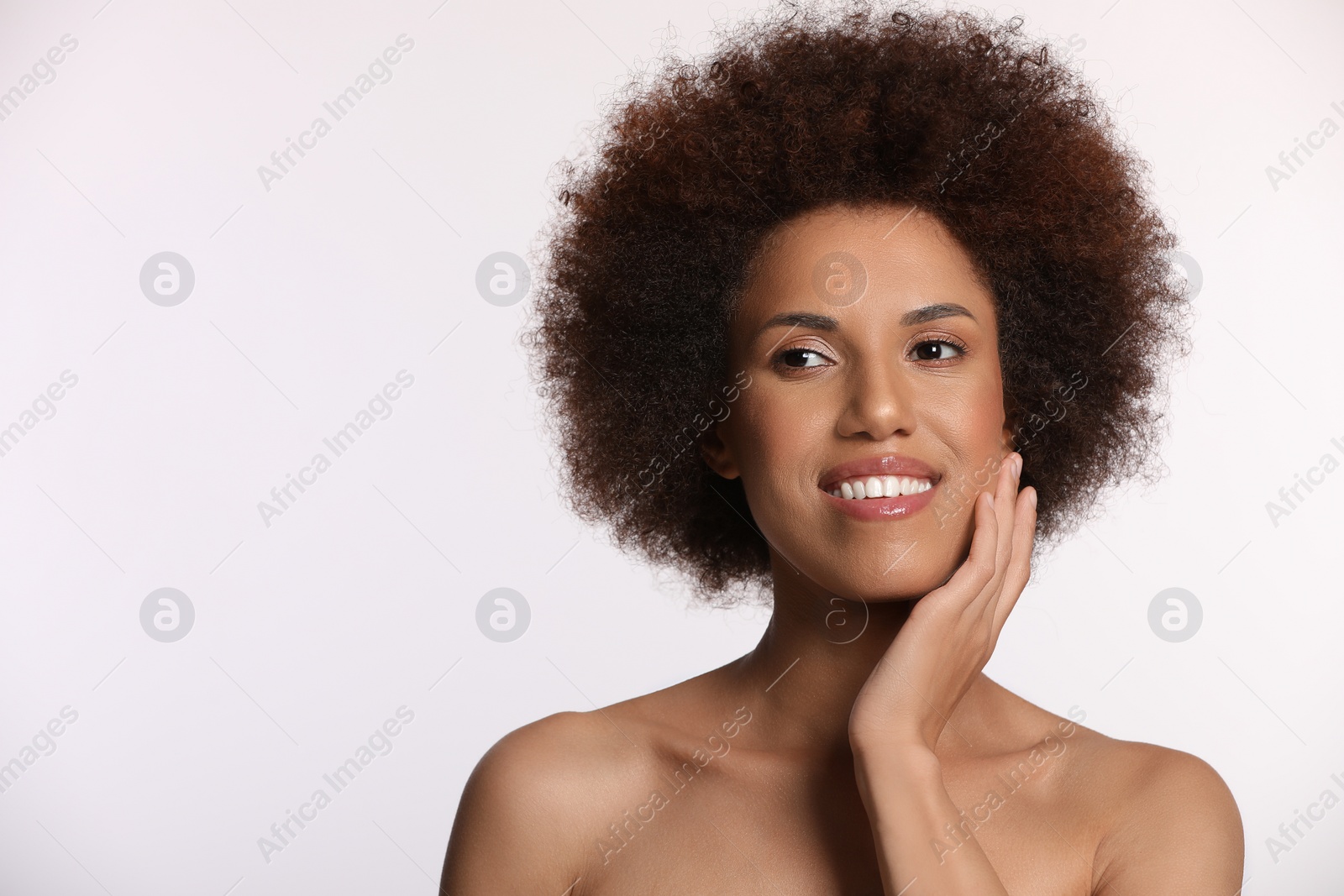 Photo of Portrait of beautiful young woman with glamorous makeup on white background. Space for text