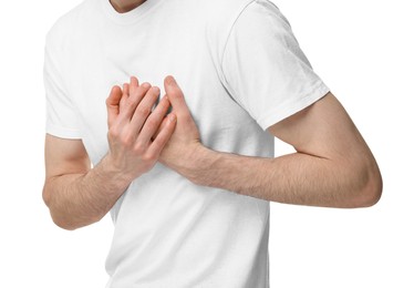 Man suffering from heart hurt on white background, closeup
